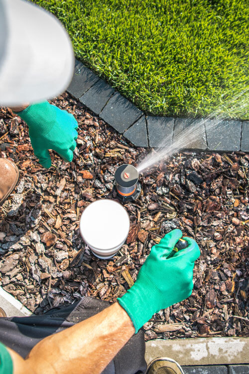 Person Installing Sprinkler System